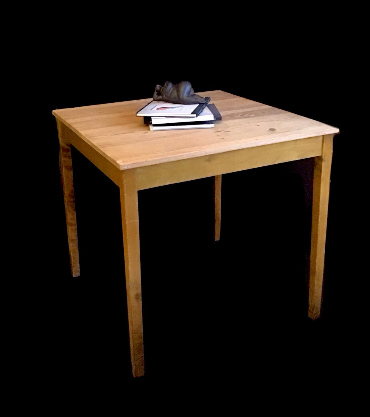 Wooden table with a black background