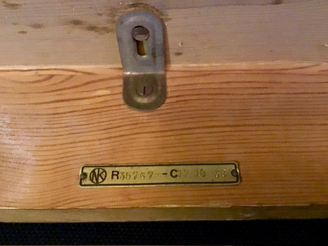 Wooden surface with a metal lock and label