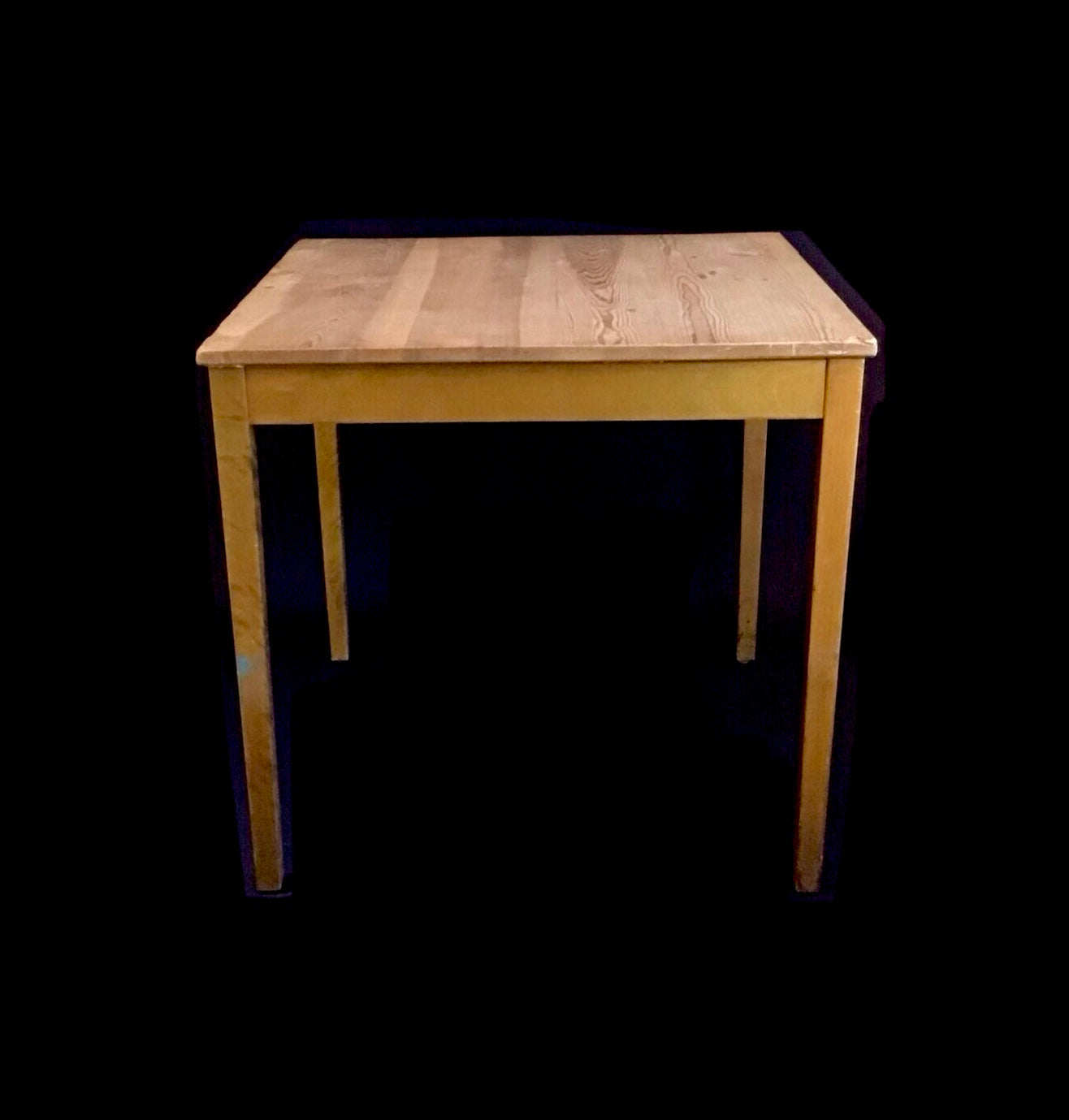 Wooden table on a black background