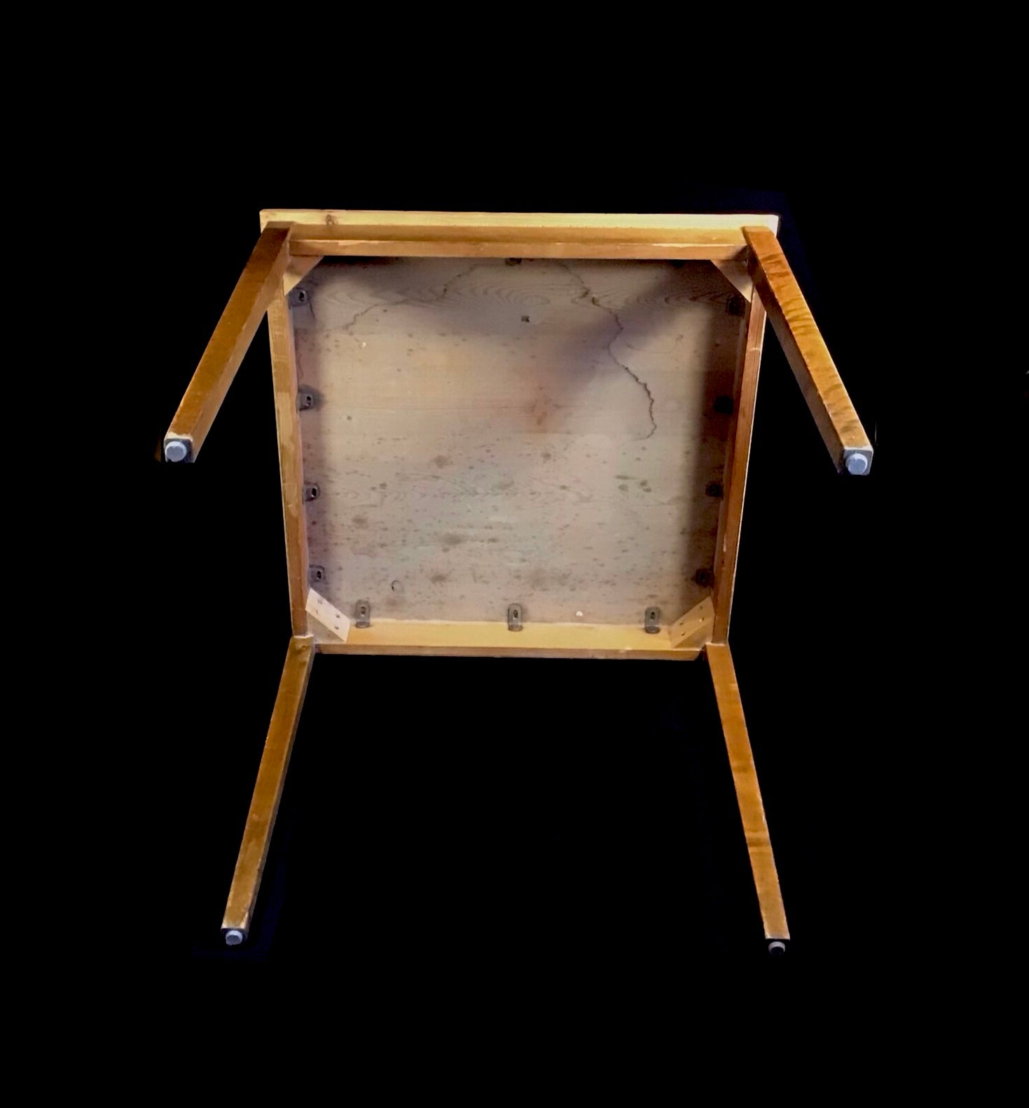 Wooden frame with a textured surface on a black background