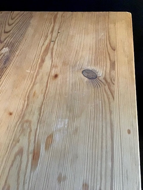 Close-up of a wooden surface with visible grain and texture