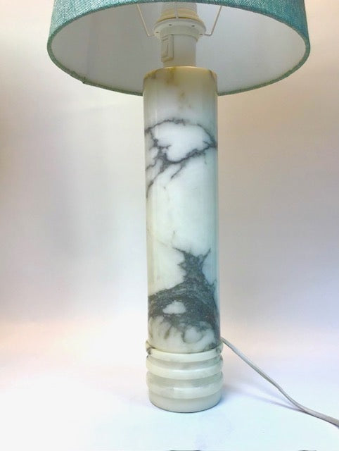 Marble-patterned lamp with a green lampshade on a white background