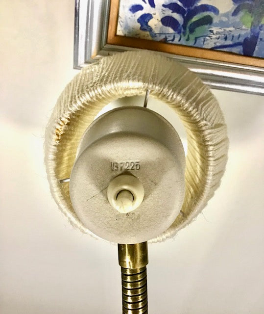 Brass fitting with a label on a white background