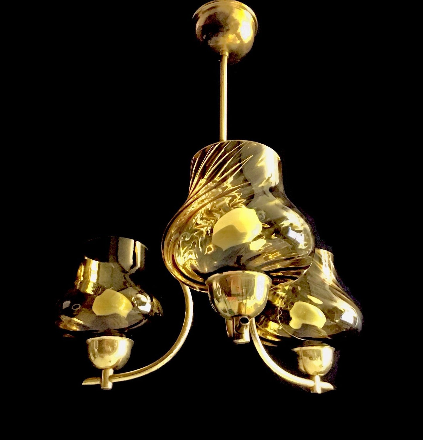 Gold chandelier against a black background