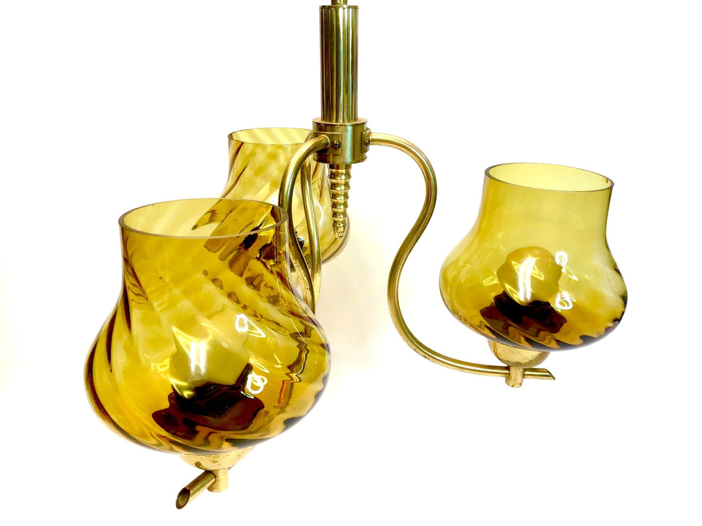 Yellow glass pitcher with handle on a white background