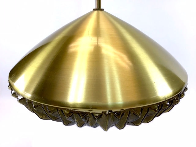 Gold pendant light on a white background