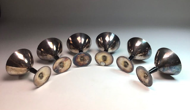 Set of metallic knobs on a gradient background