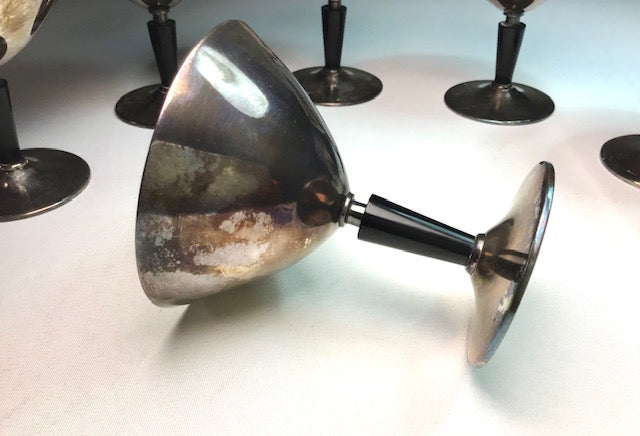 Metallic wall-mounted light fixture on a white background