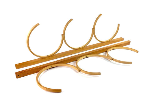 Set of wooden curtain rods on a white background