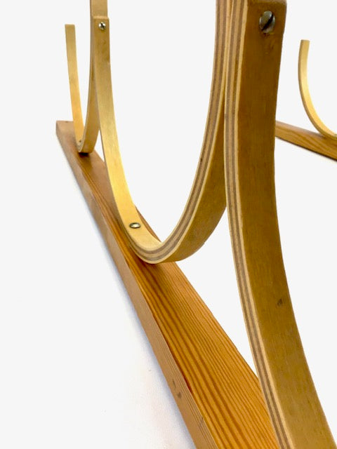 Wooden ski boot holder on a white background