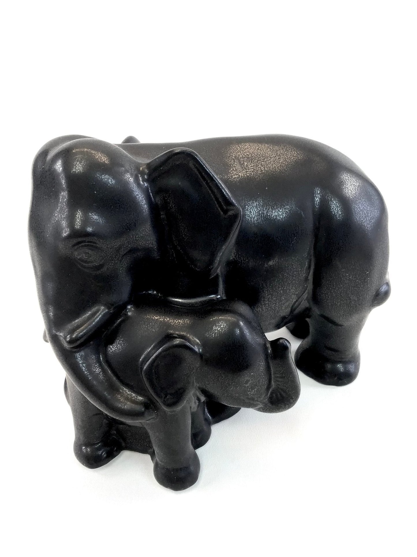Black elephant figurine on a white background