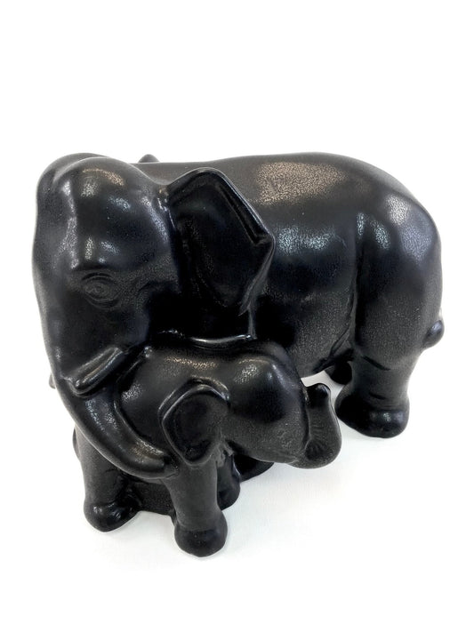 Black elephant figurine on a white background