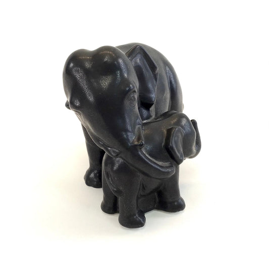 Black elephant figurine on a white background