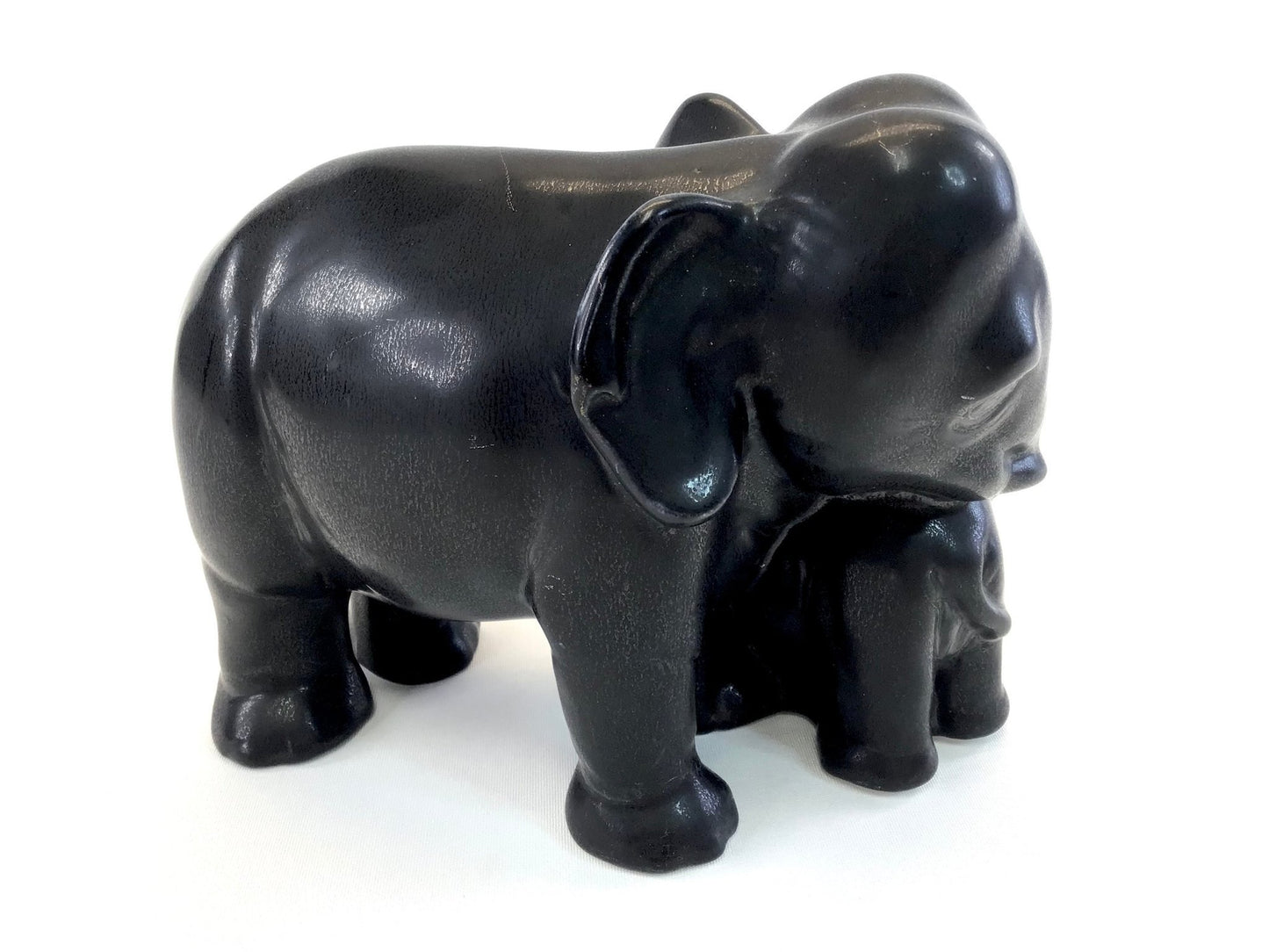 Black elephant figurine on a white background