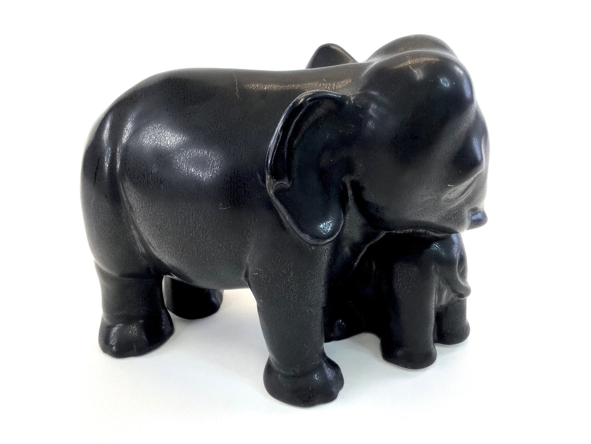 Black elephant figurine on a white background