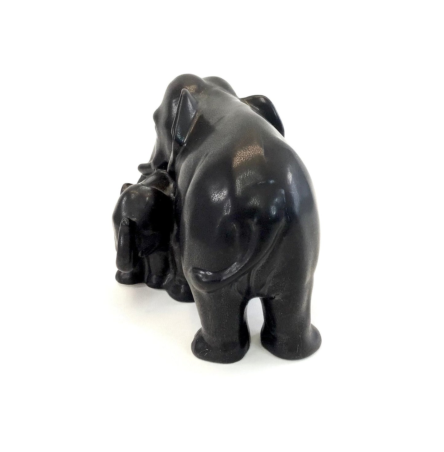 Black elephant sculpture on a white background
