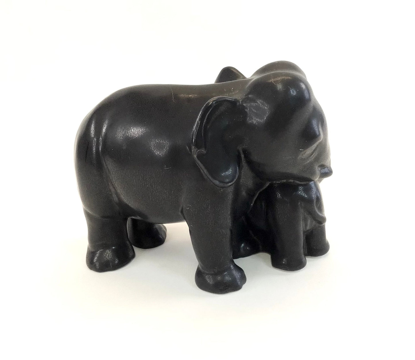 Black elephant figurine on a white background