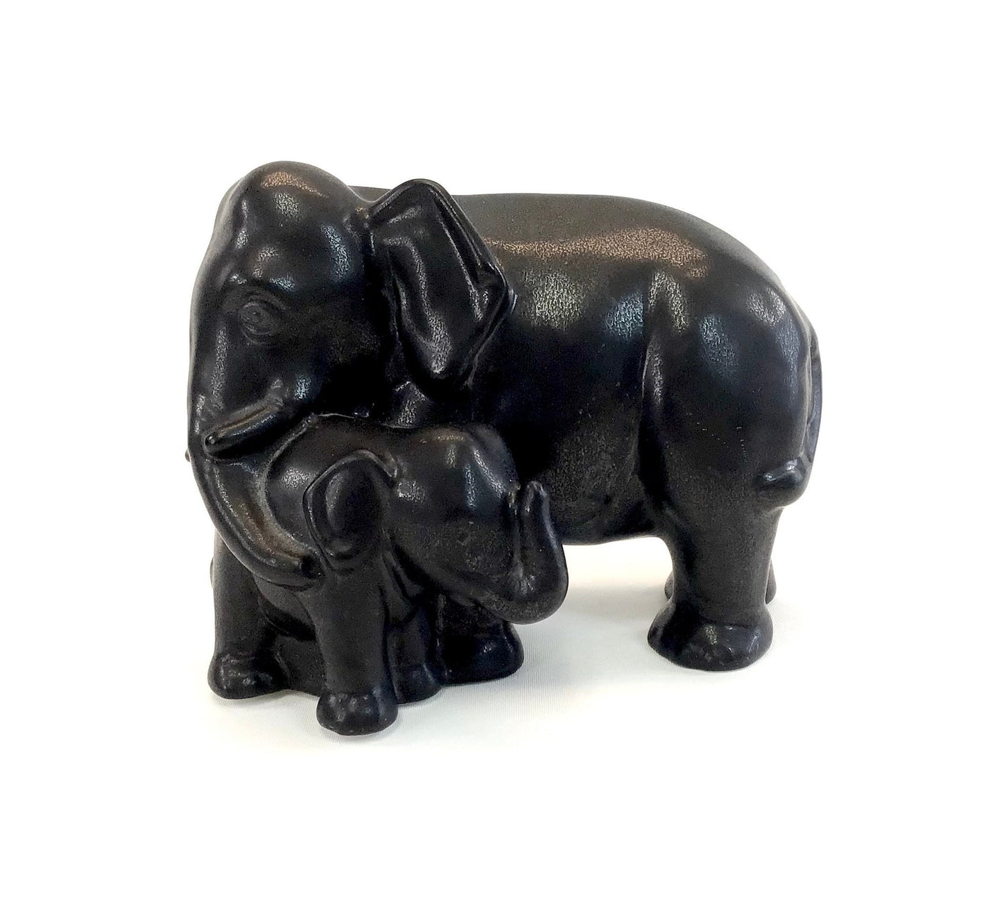 Black elephant figurine on a white background