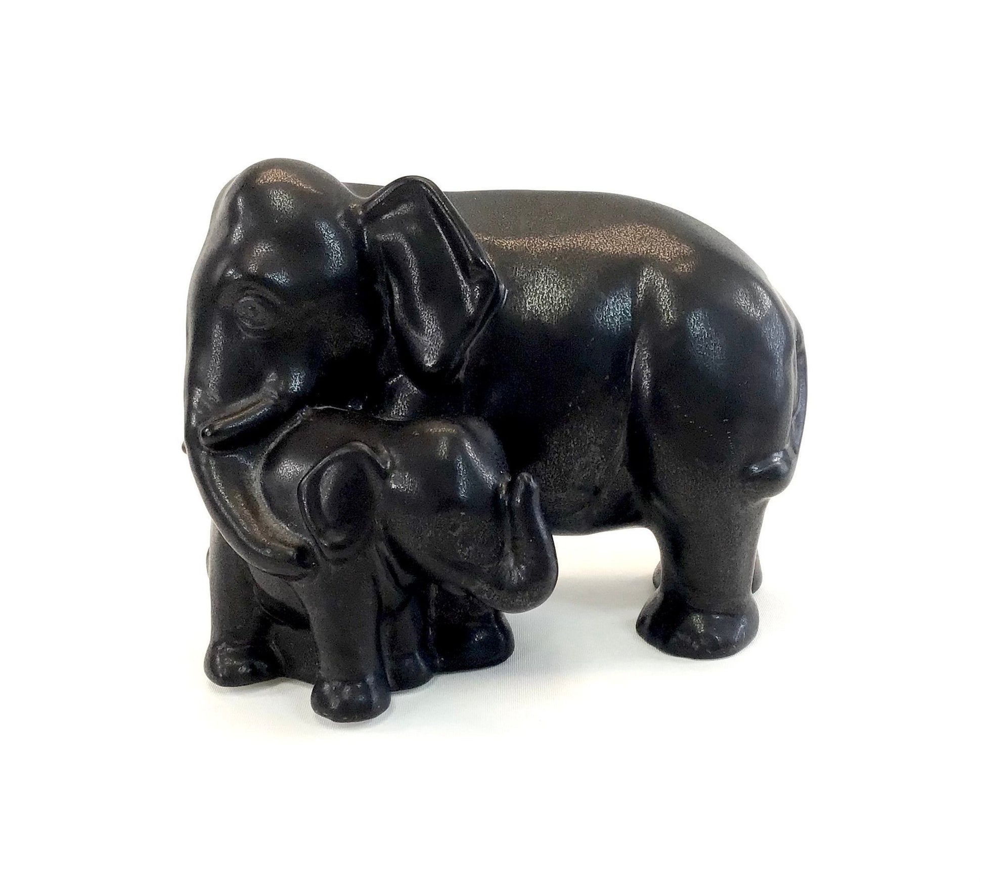 Black elephant figurine on a white background