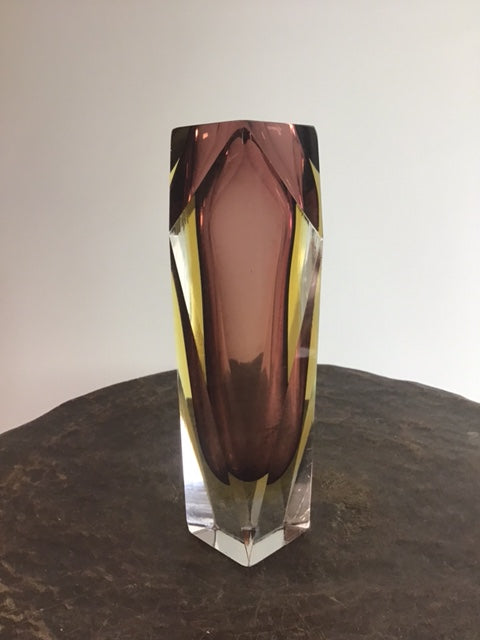 Faceted gemstone on a neutral background