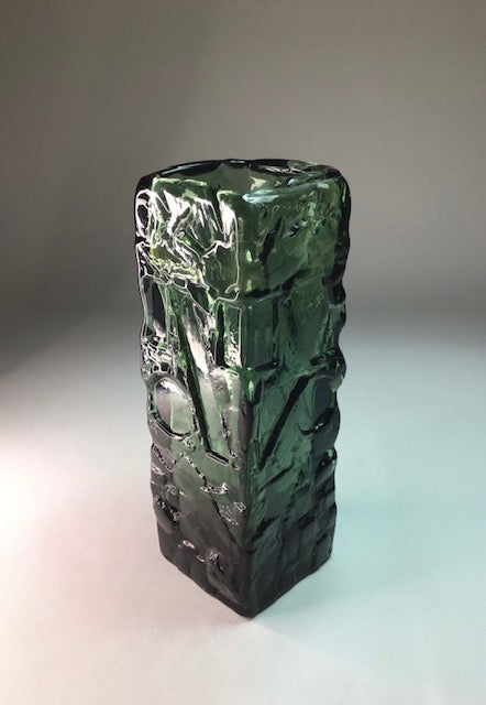 Green textured vase on a gradient background