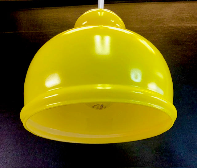 Yellow pendant light fixture on a dark background