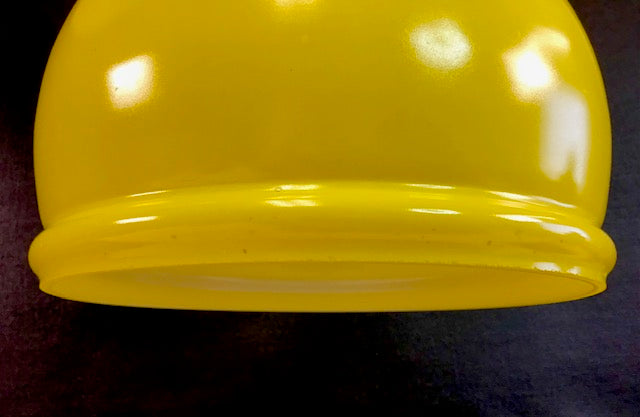 Close-up of a yellow object on a dark background