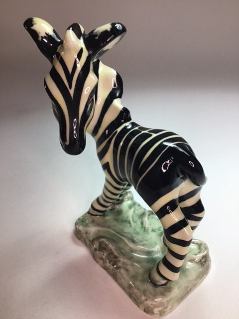 Black and white striped socks on a stone block with a blurred background