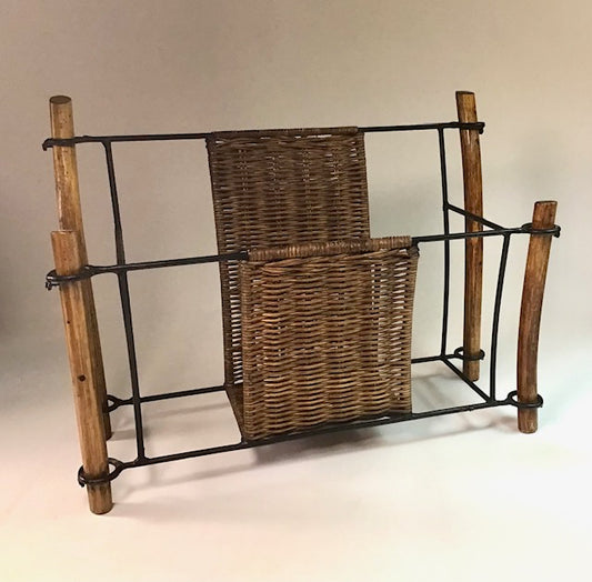 Wicker magazine rack with wooden frame on a neutral background