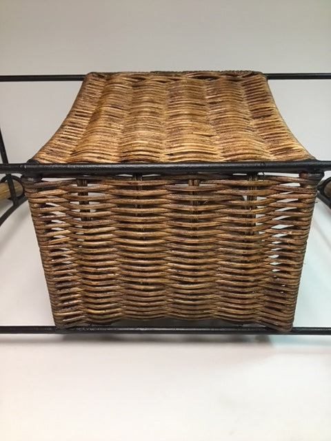 Wicker lamp with black metal frame on a white background
