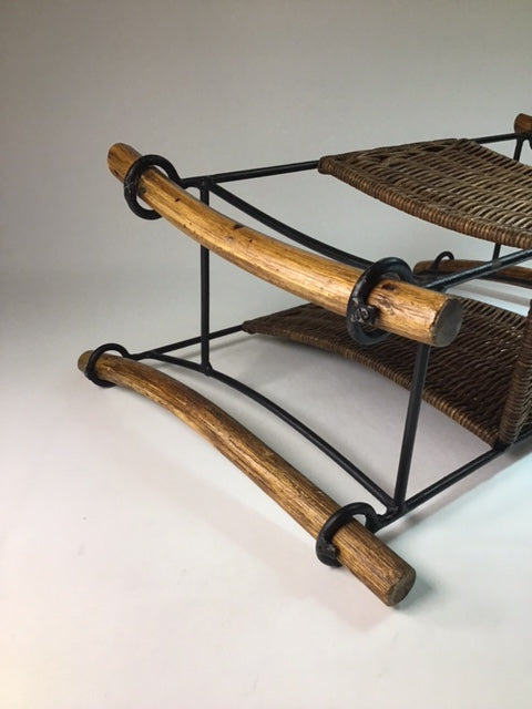 Wooden stool with wicker seat on a white background
