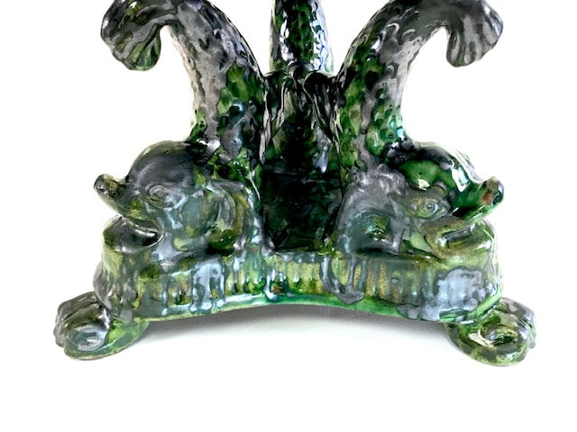 Decorative glass piece with animal figures on a white background