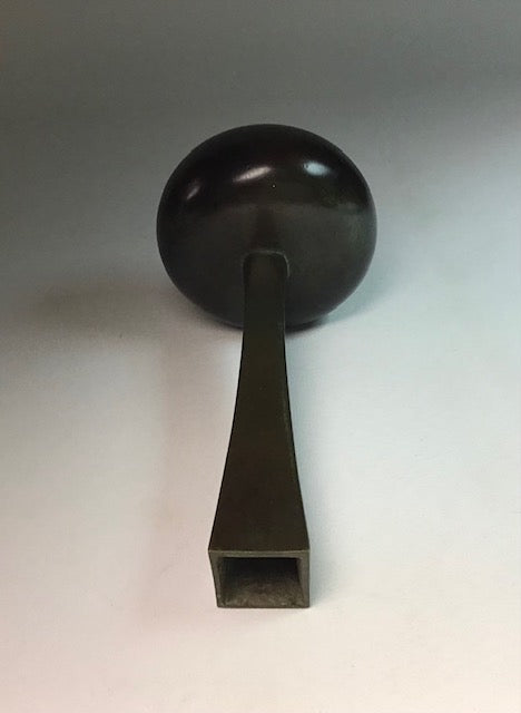 Black metal handle on a gray background