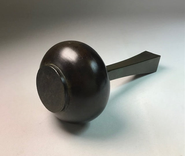 Black door handle on a light gray background