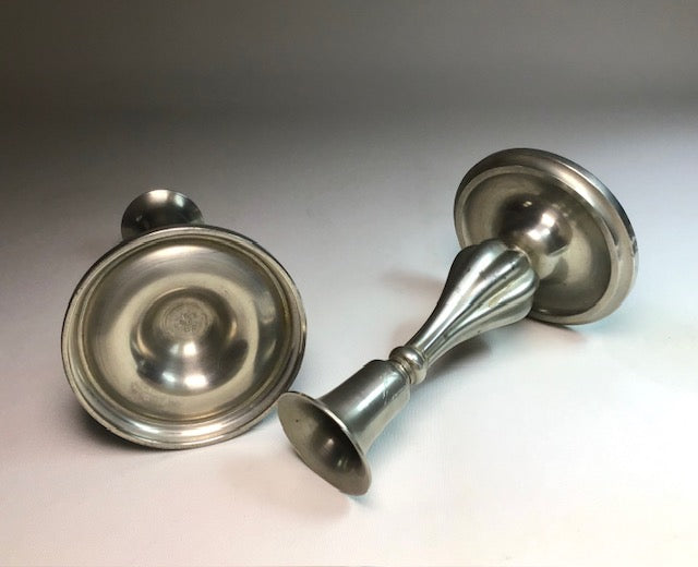 Pair of silver door handles on a neutral background