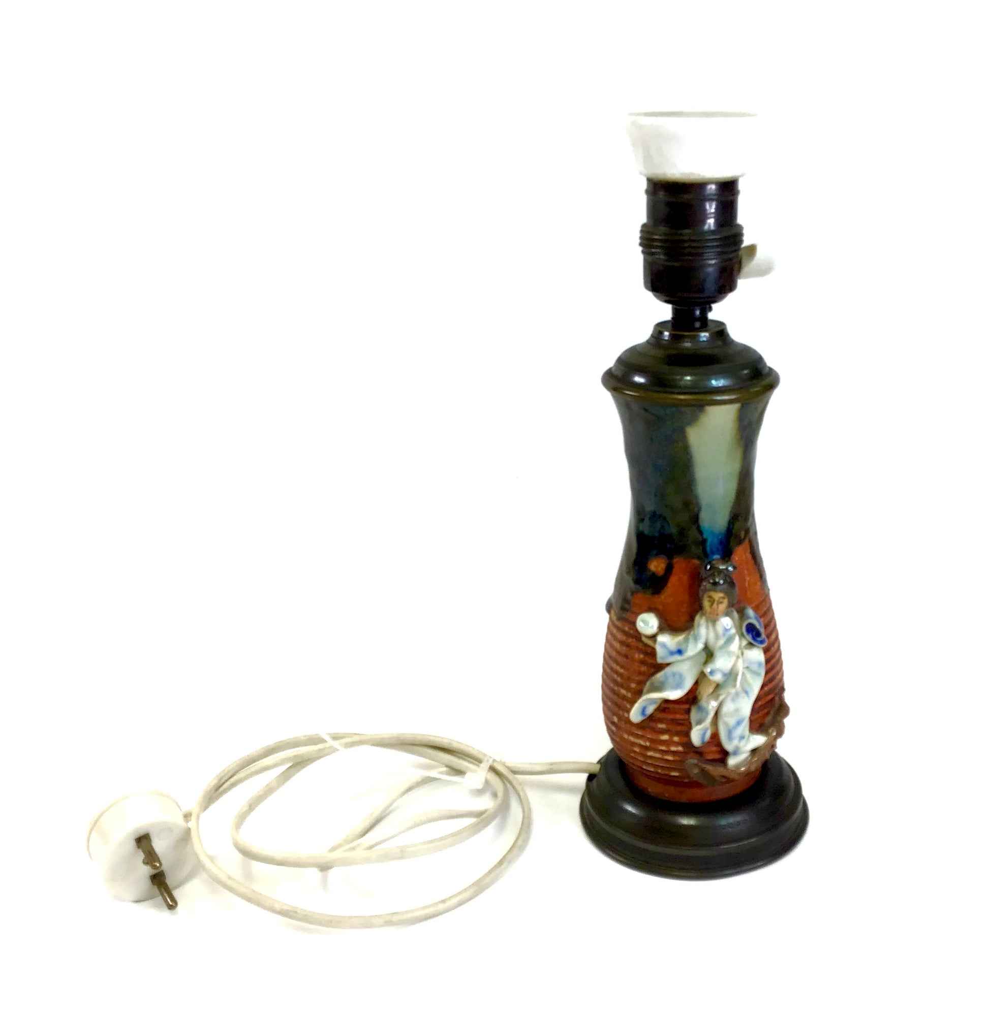 Decorative lamp with a figurine on a white background