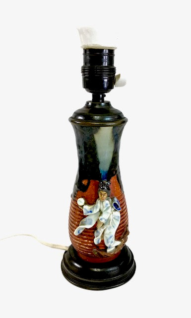 Decorative lamp with angel design on a white background