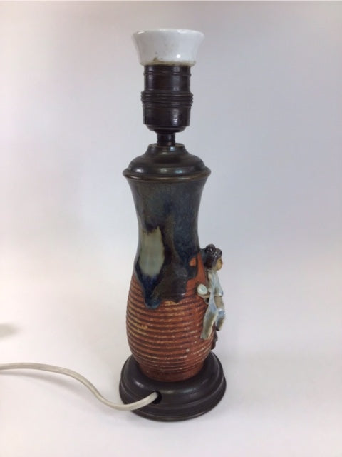 Ceramic lamp with a decorative design on a white background