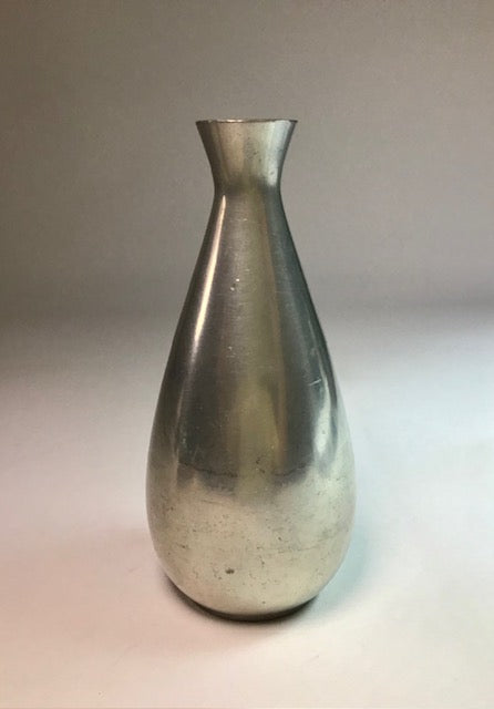 Silver metallic vase on a gradient background