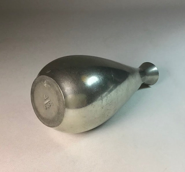 Metal flask on a light gray background