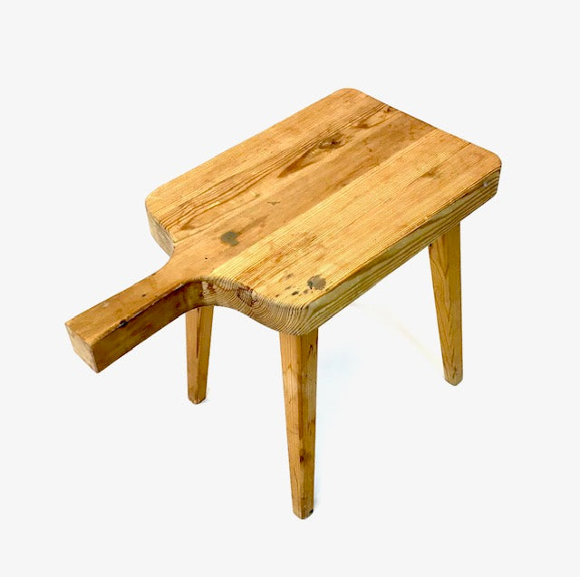 Wooden stool with a unique design on a white background