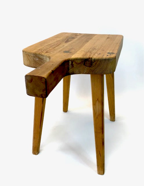 Wooden bench with a unique design on a white background