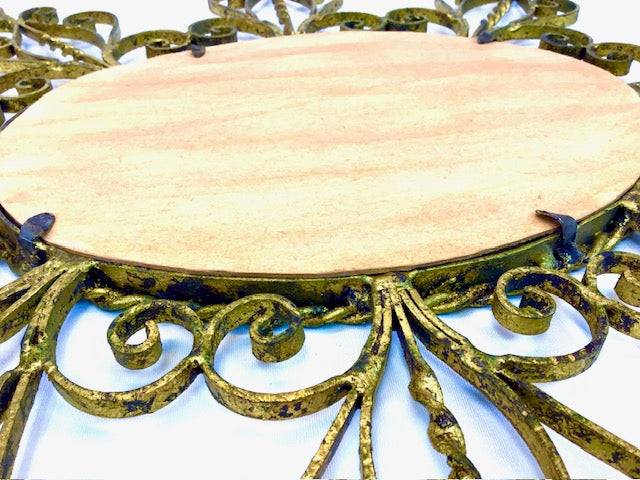 Decorative metal stand with a wooden platform on a white background