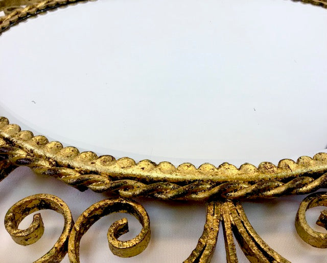 Decorative gold leaf design on a white background