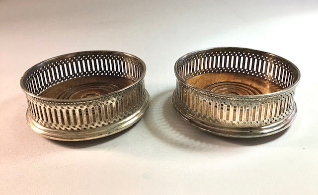 Two silver wire baskets on a white background